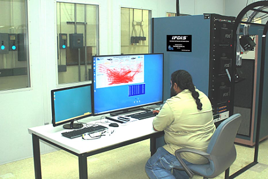 Electronics integrated systems mechanic Moses Simms readies the Intermittent Fault Detection and Isolation System